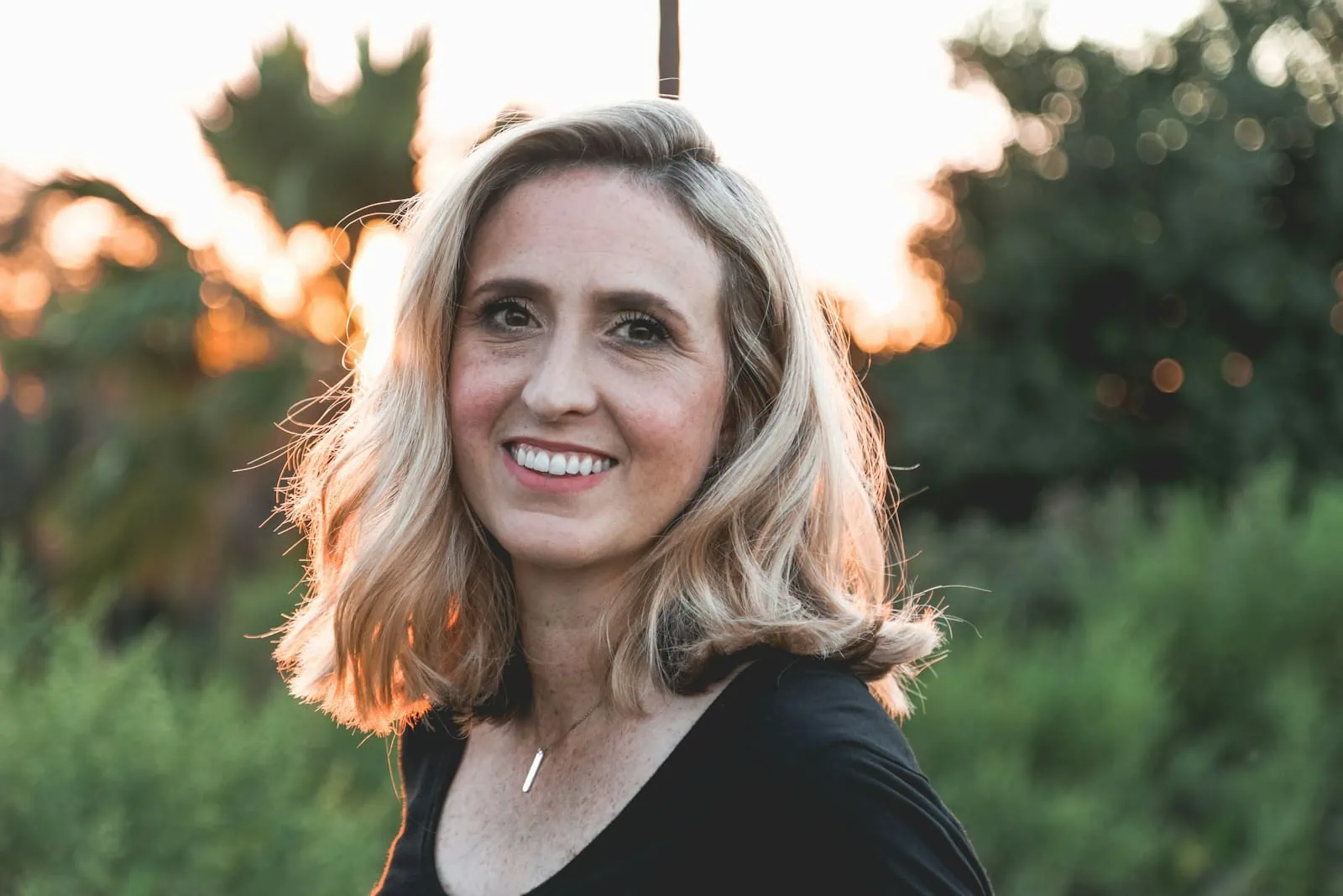 smiling woman in shallow focus photography