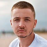 Photo by Irene Strong men's white top close-up photography